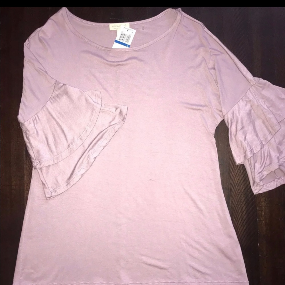 Brand New Womens Top with ruffle sleeves